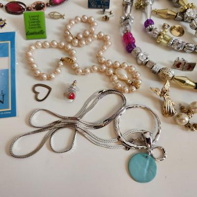 Sale Photo Thumbnail #205: This auction lot is for a Bag of Costume Jewelry.  This is a real mix of items found in a dresser drawer.  There are necklaces, earrings, pins, rings and other miscellaneous items - please see pictures.  Grab this deal quick.
