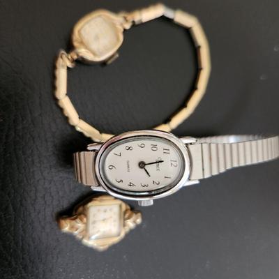 Sale Photo Thumbnail #227: This auction lot is for Three Ladies Watches.  From our latest estate there is an everyday wear Timex - appears to only need a new battery to be ready to wear.  There is an old Benrus watch marked Swiss made and show 10K RPG on the verso.  The third watch