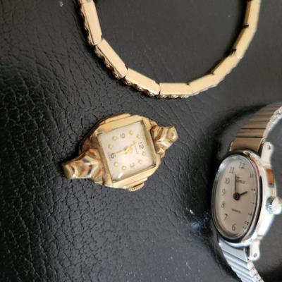 Sale Photo Thumbnail #225: This auction lot is for Three Ladies Watches.  From our latest estate there is an everyday wear Timex - appears to only need a new battery to be ready to wear.  There is an old Benrus watch marked Swiss made and show 10K RPG on the verso.  The third watch