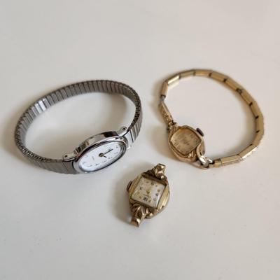 Sale Photo Thumbnail #229: This auction lot is for Three Ladies Watches.  From our latest estate there is an everyday wear Timex - appears to only need a new battery to be ready to wear.  There is an old Benrus watch marked Swiss made and show 10K RPG on the verso.  The third watch