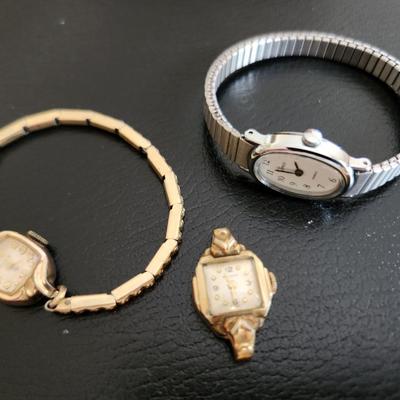 Sale Photo Thumbnail #224: This auction lot is for Three Ladies Watches.  From our latest estate there is an everyday wear Timex - appears to only need a new battery to be ready to wear.  There is an old Benrus watch marked Swiss made and show 10K RPG on the verso.  The third watch