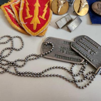 Sale Photo Thumbnail #240: This auction lot is for a gathering of Military Items. This offering contains about ten SP4 patches, three patches from the WW2 US Army Air Defense Command, a pair of Lieutenant's bars, two brass ROTC Torch emblems, a good conduct ribbon and a set of dog 