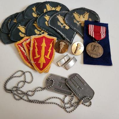 Sale Photo Thumbnail #238: This auction lot is for a gathering of Military Items. This offering contains about ten SP4 patches, three patches from the WW2 US Army Air Defense Command, a pair of Lieutenant's bars, two brass ROTC Torch emblems, a good conduct ribbon and a set of dog 