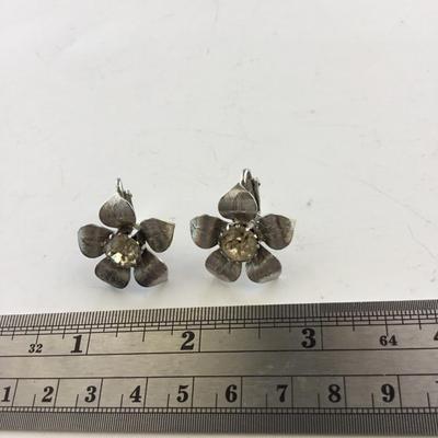 Silver tone flower clip on earrings