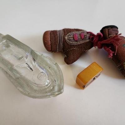Sale Photo Thumbnail #247: This fun little lot is for a Vintage Trio of Memories.  There is a glass boat candy container, a pair of souvenir miniature boxing gloves from a visit to St. Augustine, Florida and a really cool celluloid pencil sharpener from another era.  Where you gonn