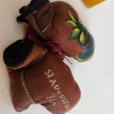 Sale Photo Thumbnail #253: This fun little lot is for a Vintage Trio of Memories.  There is a glass boat candy container, a pair of souvenir miniature boxing gloves from a visit to St. Augustine, Florida and a really cool celluloid pencil sharpener from another era.  Where you gonn