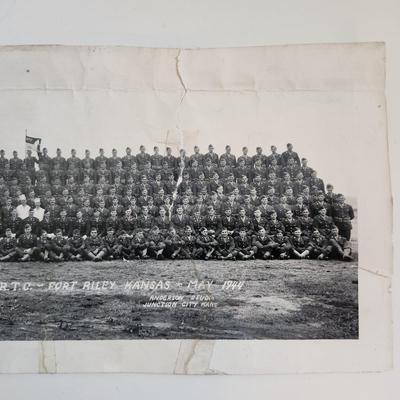 Sale Photo Thumbnail #282: This auction lot is for two WW2 Training Regiment Photographs.  This are both identical and show Troop G, First Training Regiment - CRTC - Fort Riley, KS dated May 1944.  One of photos is rolled and the other is flat.  The flat photo has cracking damaged 