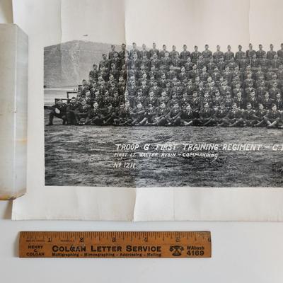 Sale Photo Thumbnail #285: This auction lot is for two WW2 Training Regiment Photographs.  This are both identical and show Troop G, First Training Regiment - CRTC - Fort Riley, KS dated May 1944.  One of photos is rolled and the other is flat.  The flat photo has cracking damaged 