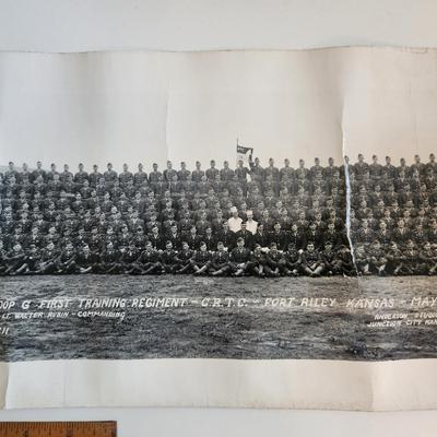 Sale Photo Thumbnail #287: This auction lot is for two WW2 Training Regiment Photographs.  This are both identical and show Troop G, First Training Regiment - CRTC - Fort Riley, KS dated May 1944.  One of photos is rolled and the other is flat.  The flat photo has cracking damaged 