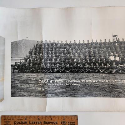 Sale Photo Thumbnail #286: This auction lot is for two WW2 Training Regiment Photographs.  This are both identical and show Troop G, First Training Regiment - CRTC - Fort Riley, KS dated May 1944.  One of photos is rolled and the other is flat.  The flat photo has cracking damaged 