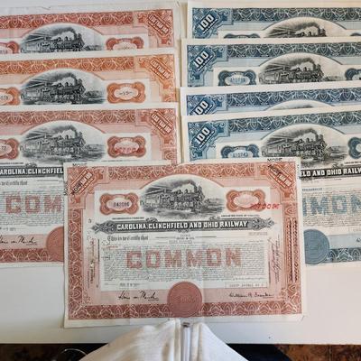 Sale Photo Thumbnail #311: This auction lot is for a gathering of eight certificates of Railroad Stock Shares.  These shares have been cashed in and hold not monetary value other than for their handsome graphics.  Many folks use this for many purposes - get yours here.