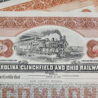 Sale Photo Thumbnail #317: This auction lot is for a gathering of eight certificates of Railroad Stock Shares.  These shares have been cashed in and hold not monetary value other than for their handsome graphics.  Many folks use this for many purposes - get yours here.