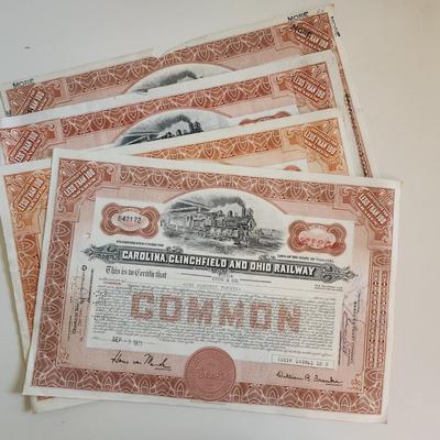 Sale Photo Thumbnail #316: This auction lot is for a gathering of eight certificates of Railroad Stock Shares.  These shares have been cashed in and hold not monetary value other than for their handsome graphics.  Many folks use this for many purposes - get yours here.