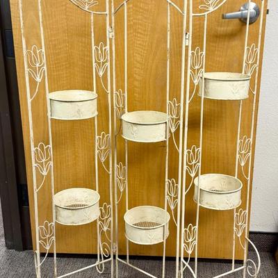 Sale Photo Thumbnail #199: Opens in a zig-zag line and can hold 6 potted plants.  Painted wrought iron. Approx. 47" tall and 36" wide when fully opened.  Can fold into a small size for storage.