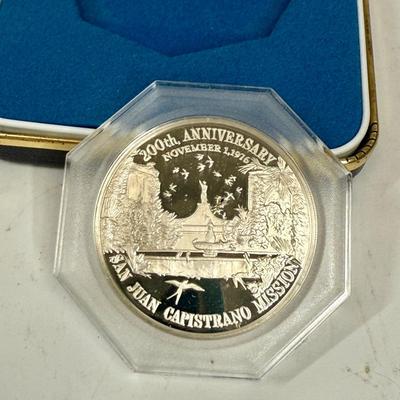 Sale Photo Thumbnail #382: SOLID STERLING SILVER medal, it comes in a preservation capsule. Minted by The Franklin Mint in 1976, Commemorating Father Junipero Serra and the 200th anniversary of San Juan Capistrano Mission (1776-1976). It measures 1.5 inches (39mm) and weighs 22 GRA