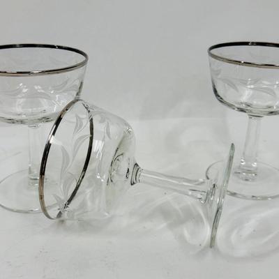 Sale Photo Thumbnail #396: Set of 3, frosted etched leaves around the body of the glass. Good condition, approx. 4.5” tall