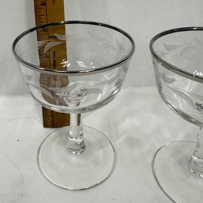 Sale Photo Thumbnail #395: Set of 3, frosted etched leaves around the body of the glass. Good condition, approx. 4.5” tall