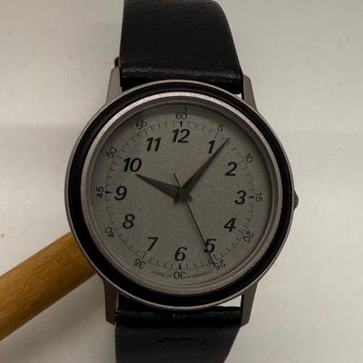 Sale Photo Thumbnail #151: Made in West Germany. Water resistant to 3 ATM. Black leather band, watch face is approx. 32mm. Good condition, needs a new battery.