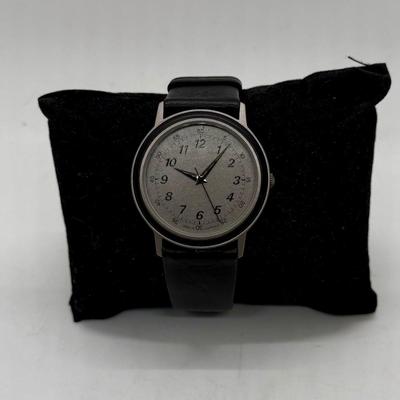 Sale Photo Thumbnail #148: Made in West Germany. Water resistant to 3 ATM. Black leather band, watch face is approx. 32mm. Good condition, needs a new battery.