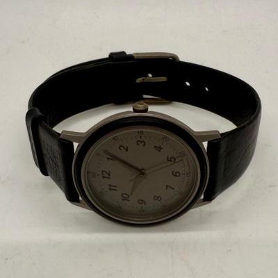 Sale Photo Thumbnail #150: Made in West Germany. Water resistant to 3 ATM. Black leather band, watch face is approx. 32mm. Good condition, needs a new battery.