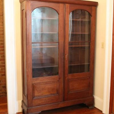 Antique Glass-Front Cabinet with Arched Doors