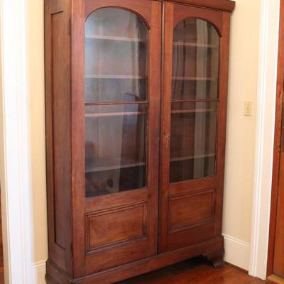 Antique Glass-Front Cabinet with Arched Doors