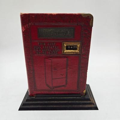LOT 32: Glass Bank Filled with Wheat Pennies, Cylinder Filled with Steel Pennies and Zell Products Corp. Book Bank with Key Filled with...