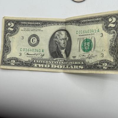 LOT 56: Currency Collection: Susan B. Anthony 1979 Half Dollar, Three 2 Dollar Bills, Silver Certificates and More!