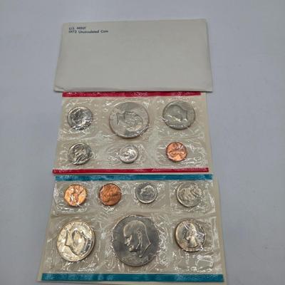 LOT 124: U.S. Mint Uncirculated Coin Sets from 1969, 1971, 1973, 1975, and Special Mint Set from 1965