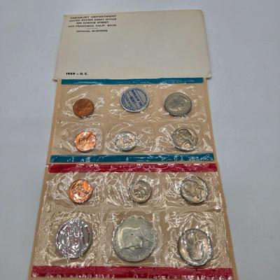 LOT 124: U.S. Mint Uncirculated Coin Sets from 1969, 1971, 1973, 1975, and Special Mint Set from 1965