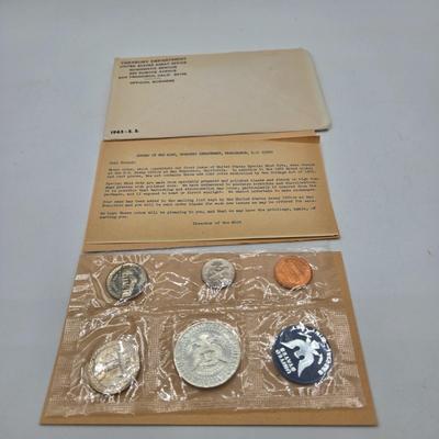 LOT 124: U.S. Mint Uncirculated Coin Sets from 1969, 1971, 1973, 1975, and Special Mint Set from 1965