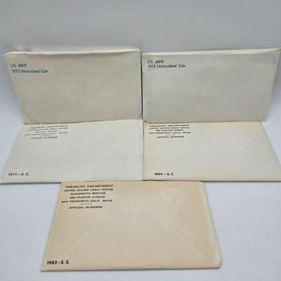 LOT 124: U.S. Mint Uncirculated Coin Sets from 1969, 1971, 1973, 1975, and Special Mint Set from 1965