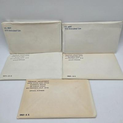 LOT 124: U.S. Mint Uncirculated Coin Sets from 1969, 1971, 1973, 1975, and Special Mint Set from 1965