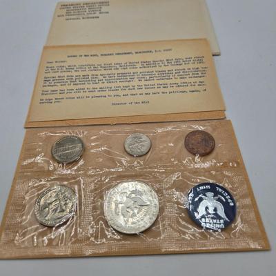 LOT 126: U.S. Mint Uncirculated Coin Sets from 1969, 1971 (in Sealed Envelope), 1973, & 1975, and Special Mint Set from 1965