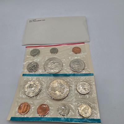 LOT 126: U.S. Mint Uncirculated Coin Sets from 1969, 1971 (in Sealed Envelope), 1973, & 1975, and Special Mint Set from 1965