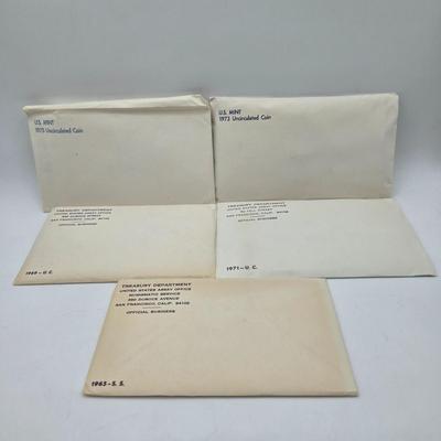 LOT 126: U.S. Mint Uncirculated Coin Sets from 1969, 1971 (in Sealed Envelope), 1973, & 1975, and Special Mint Set from 1965