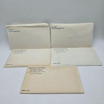 LOT 126: U.S. Mint Uncirculated Coin Sets from 1969, 1971 (in Sealed Envelope), 1973, & 1975, and Special Mint Set from 1965