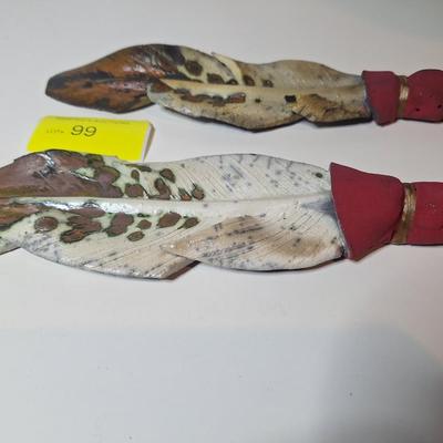 Sale Photo Thumbnail #6: lot of two, they are the same size althought he angle of the photo makes one look larger than the other.  One has a small chip or it is believed to be a chip as the the part of the feather there is not pointed.  These are delicate items, the colors are sl