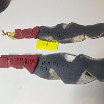 Sale Photo Thumbnail #8: lot of two, they are the same size althought he angle of the photo makes one look larger than the other.  One has a small chip or it is believed to be a chip as the the part of the feather there is not pointed.  These are delicate items, the colors are sl