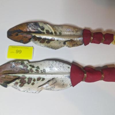 Sale Photo Thumbnail #4: lot of two, they are the same size althought he angle of the photo makes one look larger than the other.  One has a small chip or it is believed to be a chip as the the part of the feather there is not pointed.  These are delicate items, the colors are sl