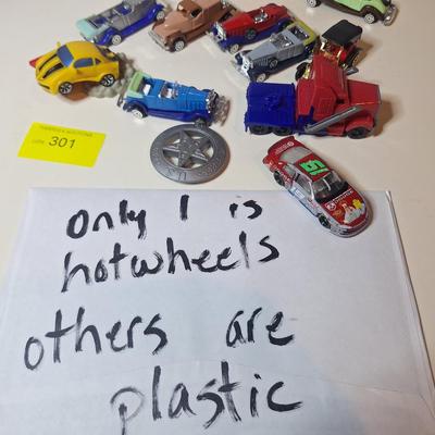 Sale Photo Thumbnail #672: 1 is a hotwheel the others are plastic cars