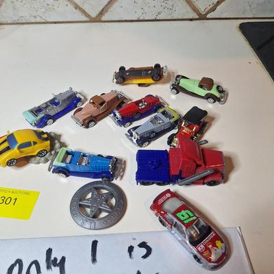 Sale Photo Thumbnail #671: 1 is a hotwheel the others are plastic cars
