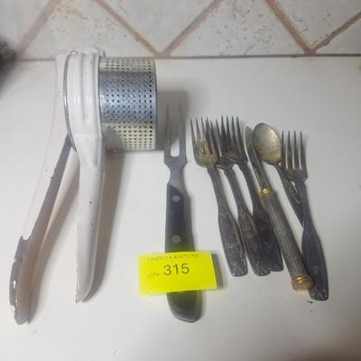 Sale Photo Thumbnail #736: vintage potato ricer and silverpate flatware etc