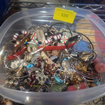 Sale Photo Thumbnail #759: this is a small container of jewelry pieces, it may be broken and mismatches jewelry, there may be a few complete pieces.  No gold or silver