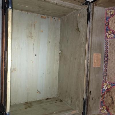 Sale Photo Thumbnail #7: This was probably called a wall trunk instead of a steamer trunk because it opens and the lid stays upright for tighter spqces like trains. Probably manufactured in 1880-1890s, amazing good shape, wheeled, leather straps are broken amd the hinges on yhe i
