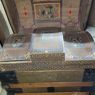 Sale Photo Thumbnail #3: This was probably called a wall trunk instead of a steamer trunk because it opens and the lid stays upright for tighter spqces like trains. Probably manufactured in 1880-1890s, amazing good shape, wheeled, leather straps are broken amd the hinges on yhe i