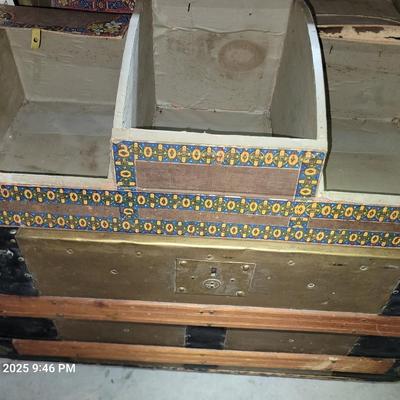 Sale Photo Thumbnail #5: This was probably called a wall trunk instead of a steamer trunk because it opens and the lid stays upright for tighter spqces like trains. Probably manufactured in 1880-1890s, amazing good shape, wheeled, leather straps are broken amd the hinges on yhe i
