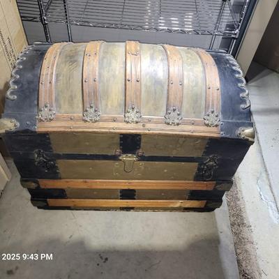 Sale Photo Thumbnail #1: This was probably called a wall trunk instead of a steamer trunk because it opens and the lid stays upright for tighter spqces like trains. Probably manufactured in 1880-1890s, amazing good shape, wheeled, leather straps are broken amd the hinges on yhe i