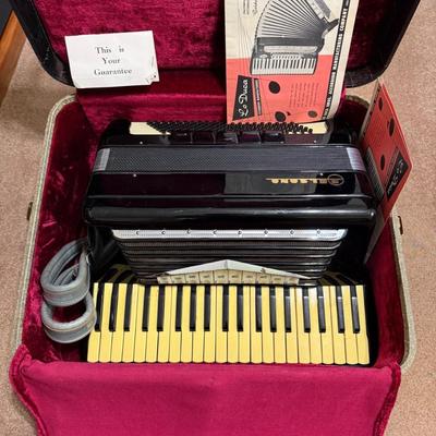 Sale Photo Thumbnail #14: Beautiful 1950's vintage Belsono 3 1/2 Octave Accordion, made by the Lo Duca Bros. Comes with case, original warrantee/ registration card, and catalog.