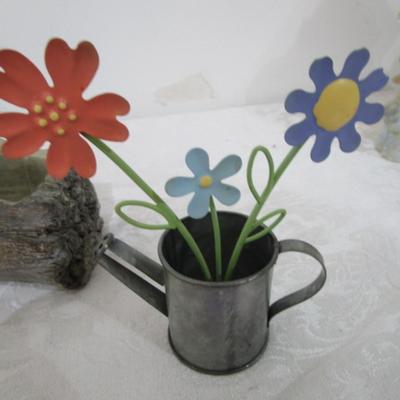 Sale Photo Thumbnail #248: Log-shaped planter, flowers in watering can 1 bear plaque, 3 key chains, 2 purse  key holders, 1 raccoon figurine, 1 vinyl butterfly